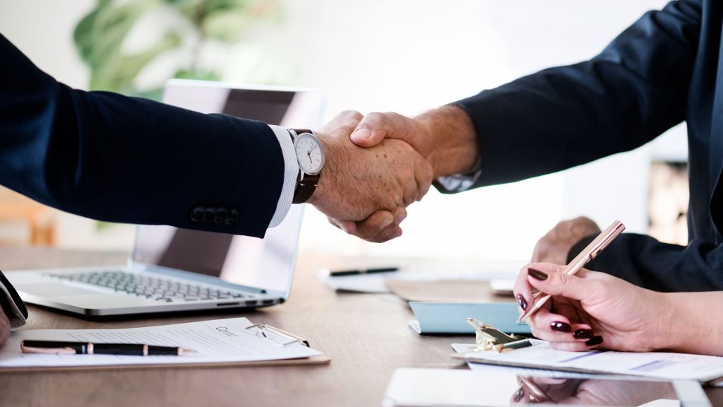 a man and woman shaking hands